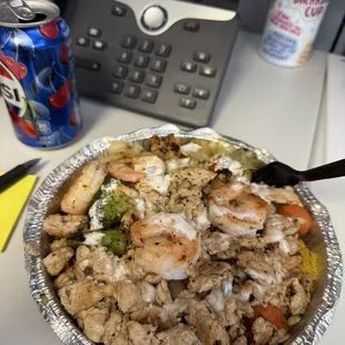 The menu is huge so I decided to go with something simple. The chicken and shrimp rice bowl with white sauce and vegetables was delicious!