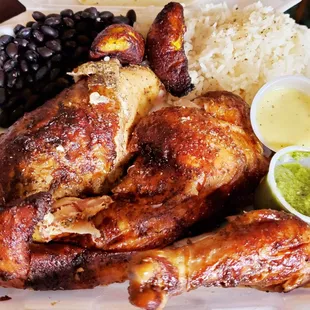 Moist well seasoned delicious 1/2 Chicken It's plenty enough for 2 meals. Rice and beans very good and fresh. 2 sauces.