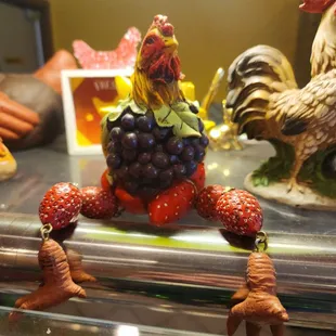 a close up of a figurine of a chicken