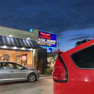 a car parked in front of a restaurant
