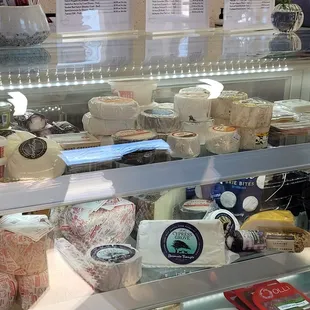 a variety of cheeses on display