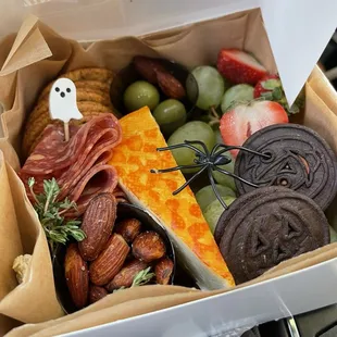 Individual charcuterie box. Sweet and savory!  She has vegetarian options as well and can customize for you!
