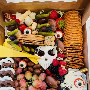 Don't waste time with standard treats for your Halloween gathering, contact Us for your death defying Charcuterie Board