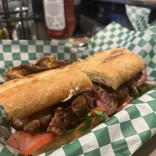 a sandwich with meat and vegetables