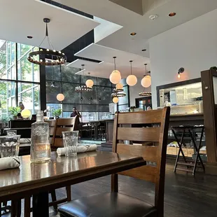 a dining area with a table and chairs