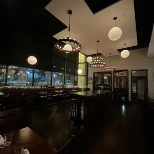 a view of a restaurant with tables and chairs