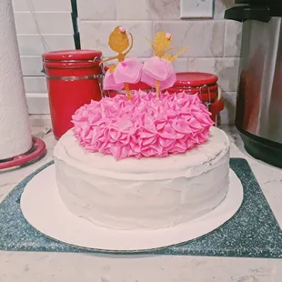 a cake decorated with pink flowers