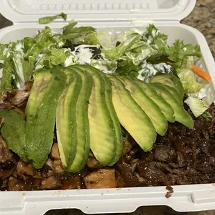 Chicken and beef teriyaki plate with avocado