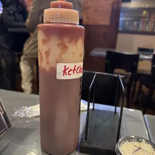 This is how they present Ketchup. No packets. Just this nasty container. Waitress has a trash can in one hand ketchup in the other