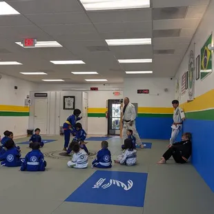 Coach Paul Instructing and leading some drills before sparring with the 4-6 year old class.