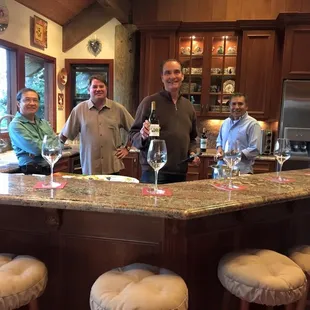 a group of men in a kitchen