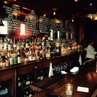 a bar filled with bottles of alcohol