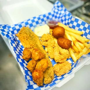 a basket of fried fish and fries
