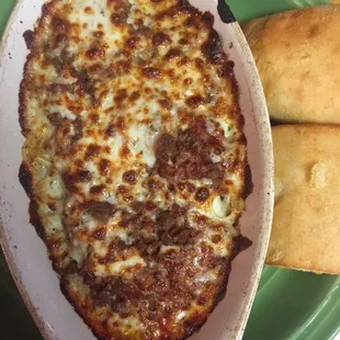 Baked spaghetti. Marinara is homemade but VERY sweet. Garlic bread is good.