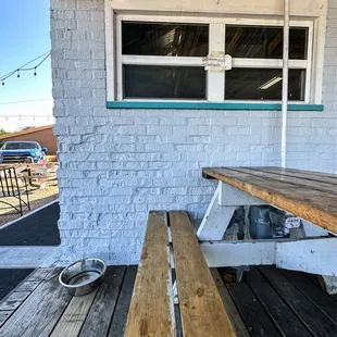 Outdoor patio seating with water bowl for your fur babies.