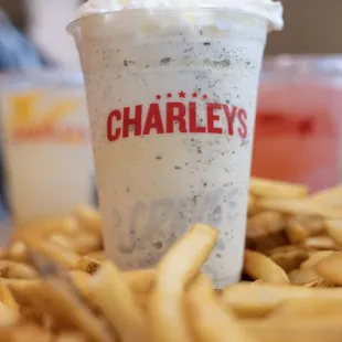 a cup of cheesesteaks and fries