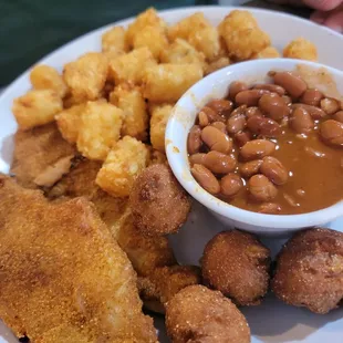 Catfish dinner with tots and ranch beans
