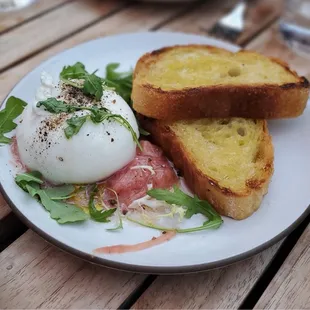 a plate of food on a wooden table