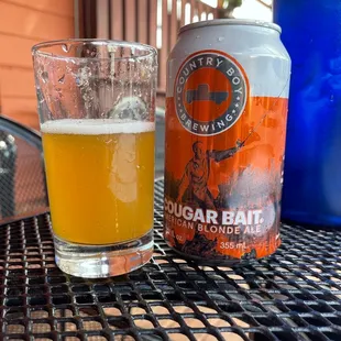 a glass of beer and a can