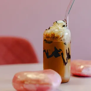 a cup of iced coffee and two donuts