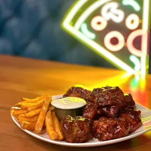 a plate of wings and french fries