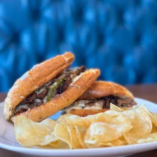 a sandwich and chips on a plate