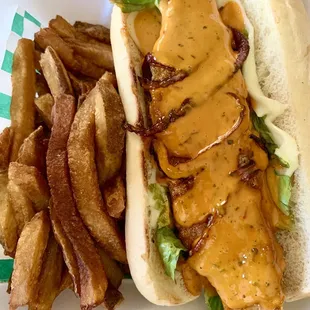Catfish Po Boy  Swiss cheese, lettuce, tomato, grilled onions and chili aioli.