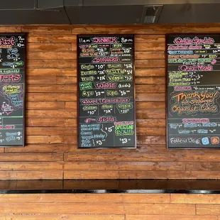 menus on a wooden wall