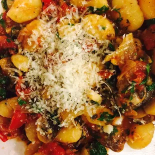 Gnocchi sautéed with mushroom, onion and tomato capper garlic sauce