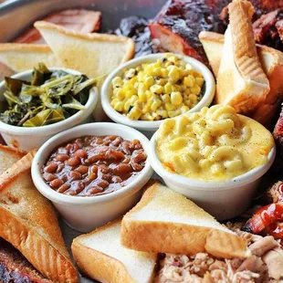 a platter of meats and sides