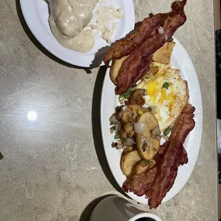 Two egg breakfast, with 2 eggs any style, with bacon as choice of protein, and biscuit with gravy instead of toast. Sweet deal.