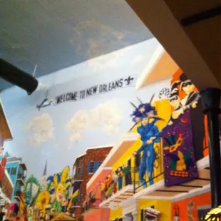 Strange ambiance...lots of murals and low hung lamps.