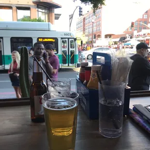 a glass of beer and a bus