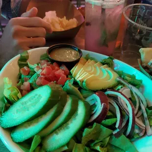 Salad and a blueberry mojito specially made for moi