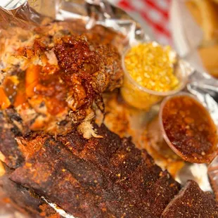  fish wrapped in foil with a side of fries