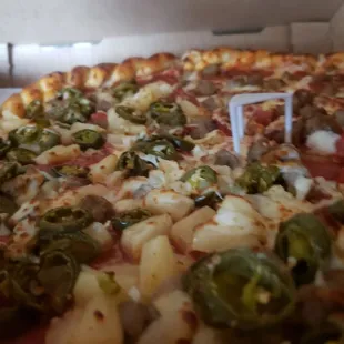 DONT ASK FOR EXTRA CHEESE! THEY ADD ENOUGH! Half Pepperoni, sausage and Pineapple and half Pineapple,Jalapeño and Pepperoni