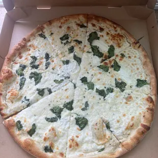 White pizza with chicken and spinach