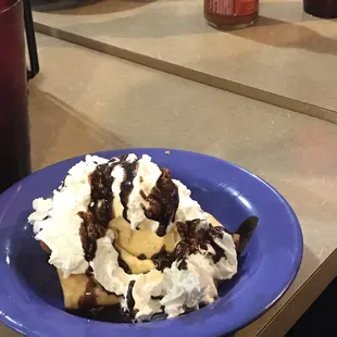 House dessert similar to the mud ball that has fried bread with vanilla ice cream and homemade chocolate fudge.