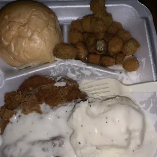 Chicken fried steak, Mashed potatoes, fries okra, and a roll