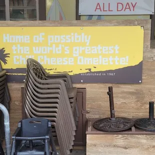 several chairs and a sign