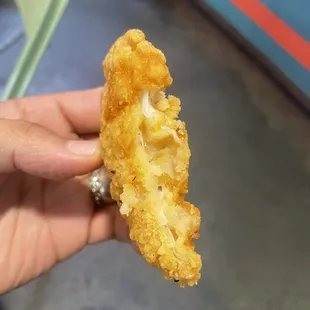 A chunk of breading masquerading as a piece of chicken.