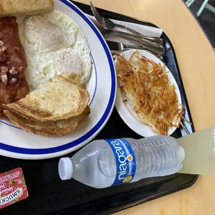 Corned beef hash with 2 eggs over medium, sourdough toast. Also added a side of hash browns.