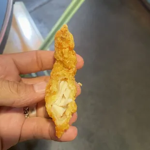 This is a piece of chicken that is frozen and hard as rock smothered in batter and undercooked.