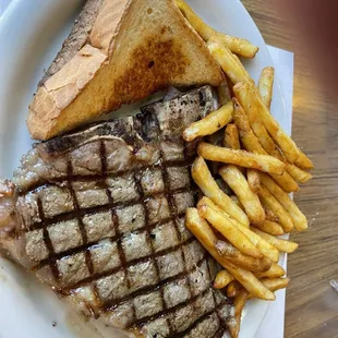 T-bone steak &amp; fries.