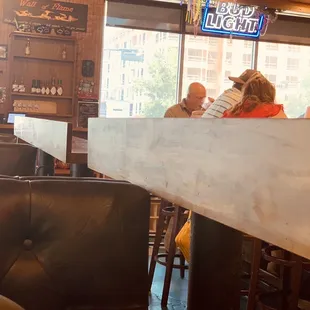 If the dress code says hats must be worn forward, why was he able to enter the restaurant &amp; comfortably sit at the bar?????