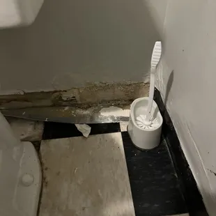 Area behind toilet that needs attention