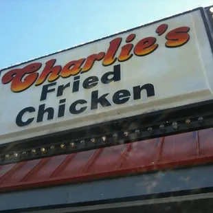 a sign for charlie&apos;s fried chicken