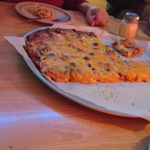 Large taco meat, green olive, and cheddar pizza.