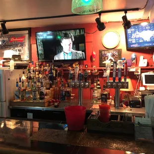 a bar with a large screen tv