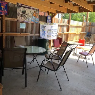 a patio with a table and chairs